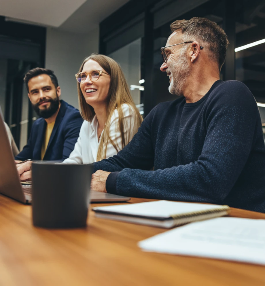 People smiling in a business meeting