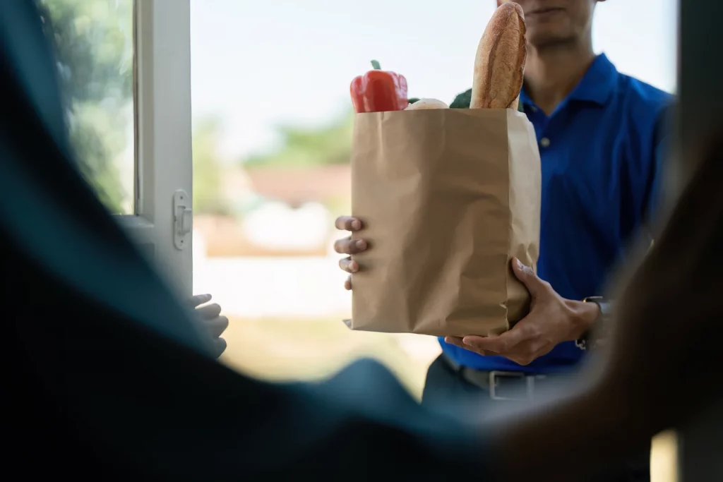 man carrying groceries