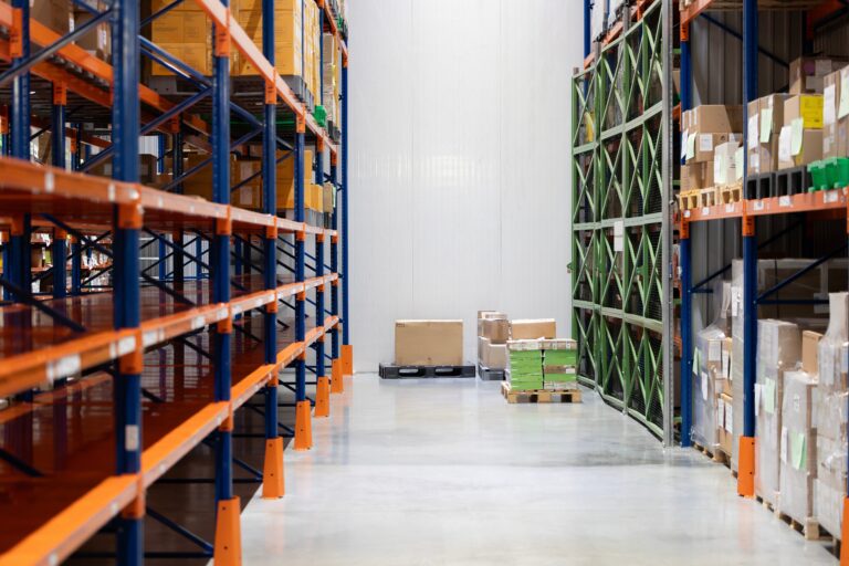 Warehouse shelves with limited inventory illustrating Amazon stockout costs